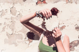 Woman covering her face