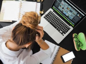 Frustrated woman at a computer
