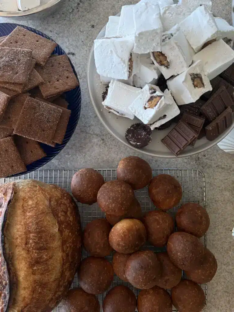Homemade bread, rolls and s'mores marshmallows on the kitchen counter